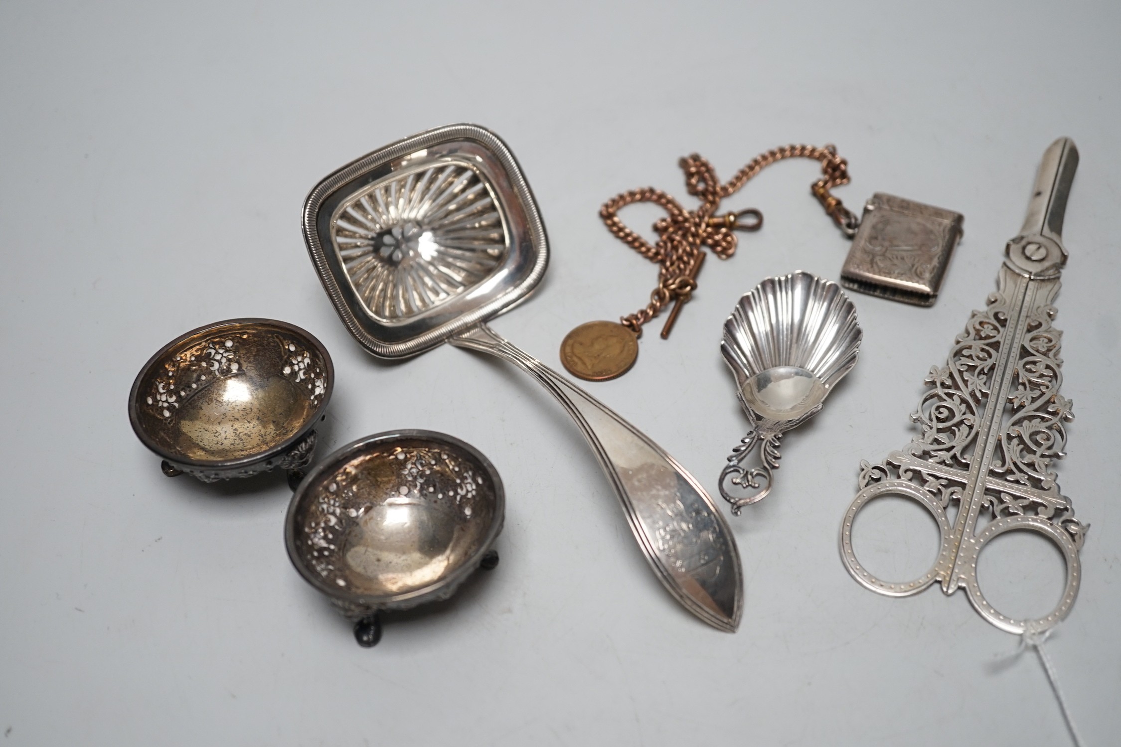 Sundry small silver including a pair of late Victorian grape shears, pair of Victorian salts caddy spoon and vesta case, together with a gilt metal albert chain and a Dutch white metal spoon.